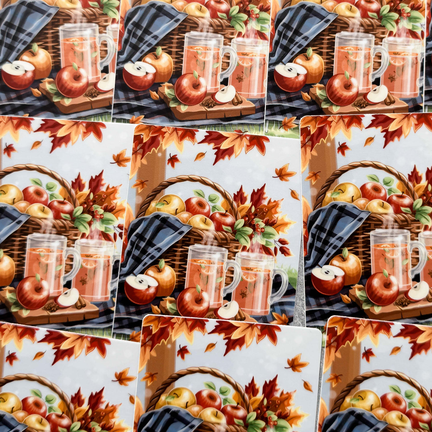 Collage of autumn-themed placemats with mugs, apples, and leaves.