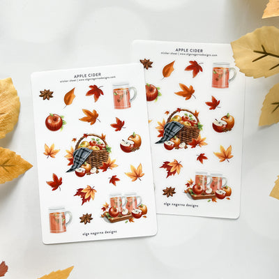 Two sheets of autumn-themed stickers with apples, leaves, and mugs on a white background.