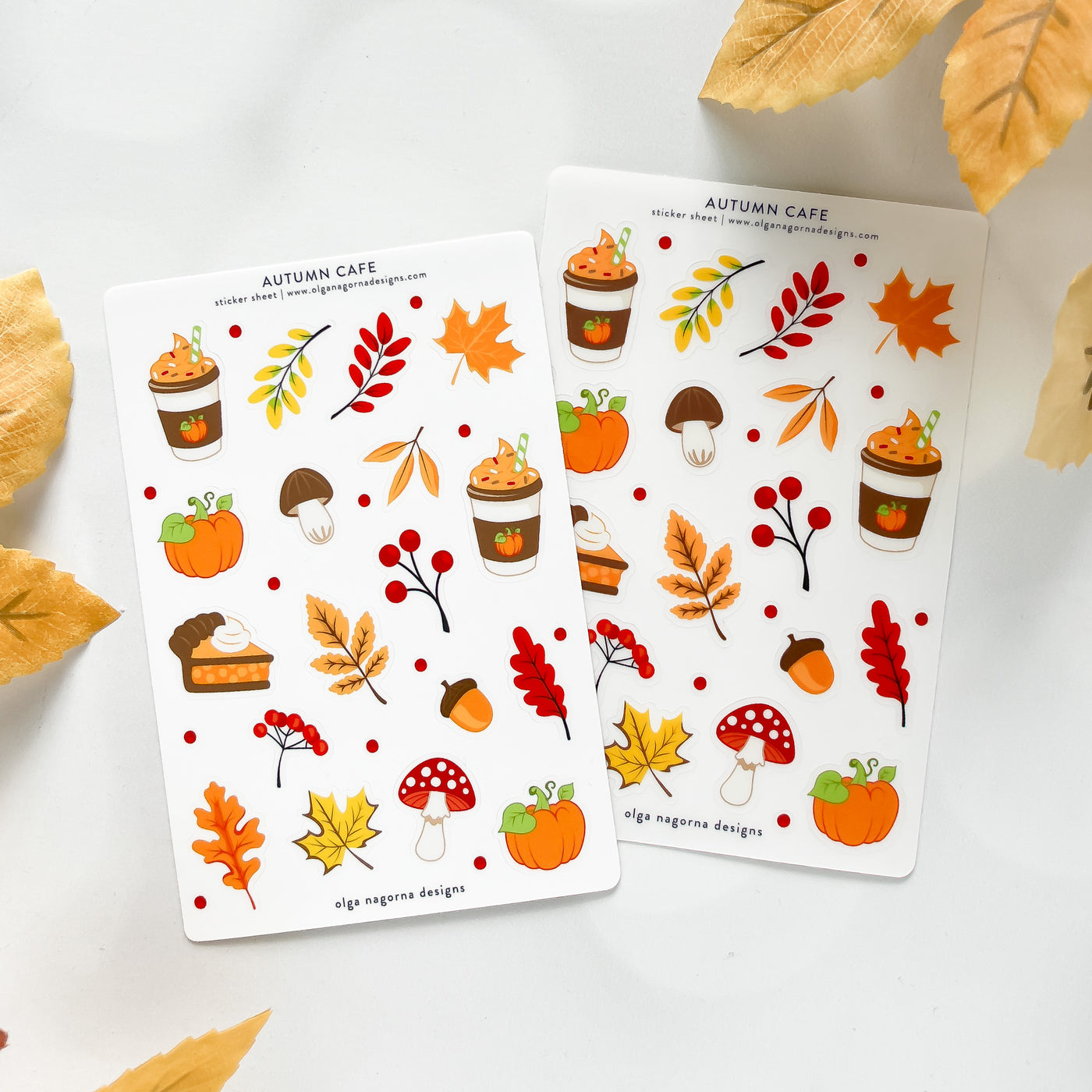Two sheets of autumn-themed stickers with pumpkins, leaves, and other fall elements on a white background.
