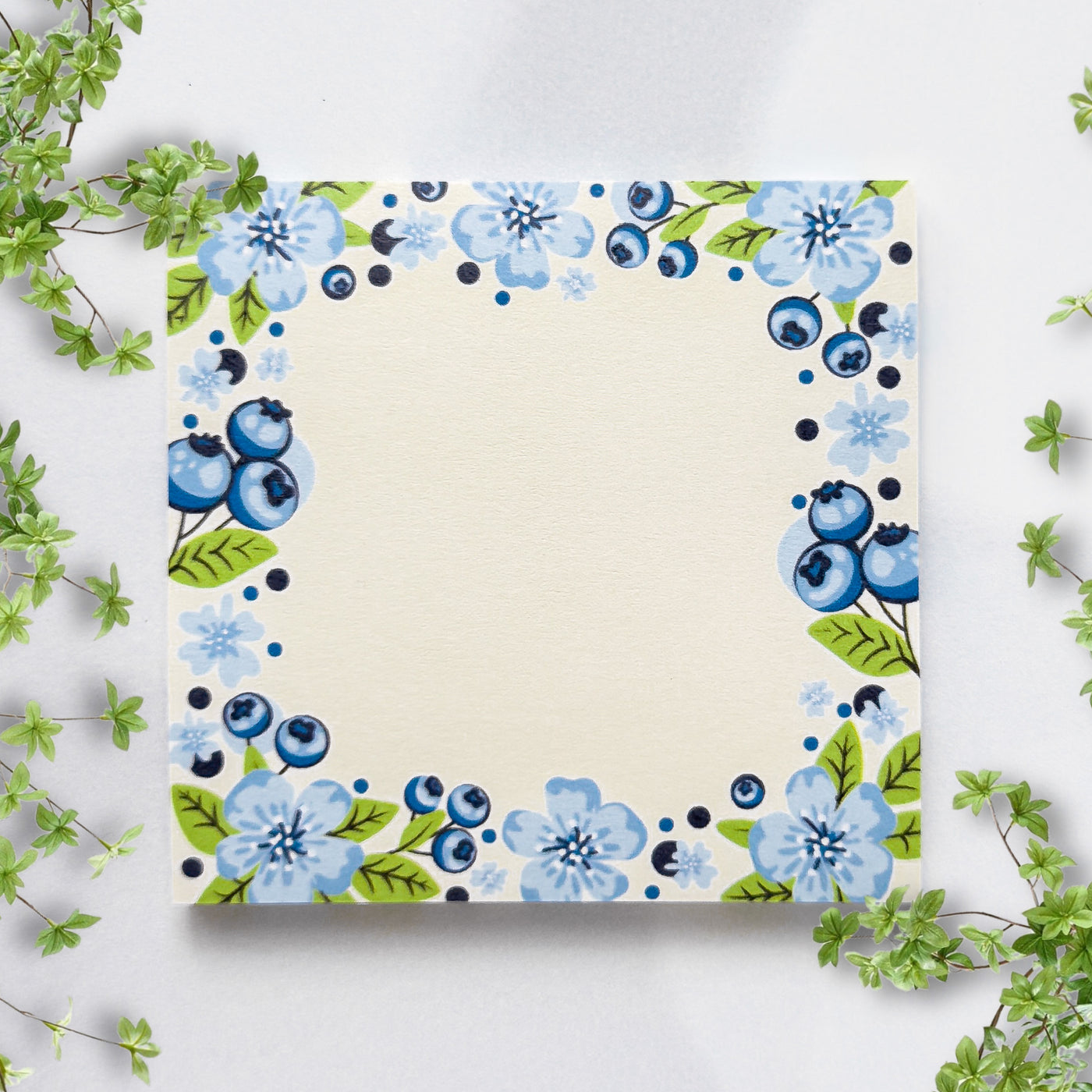 Sticky notes with blue floral design on a white background.