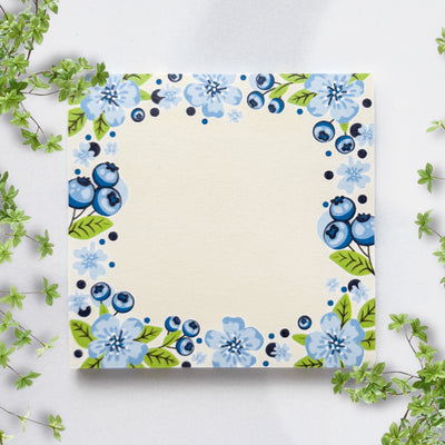 Sticky notes with blue floral design on a white background.