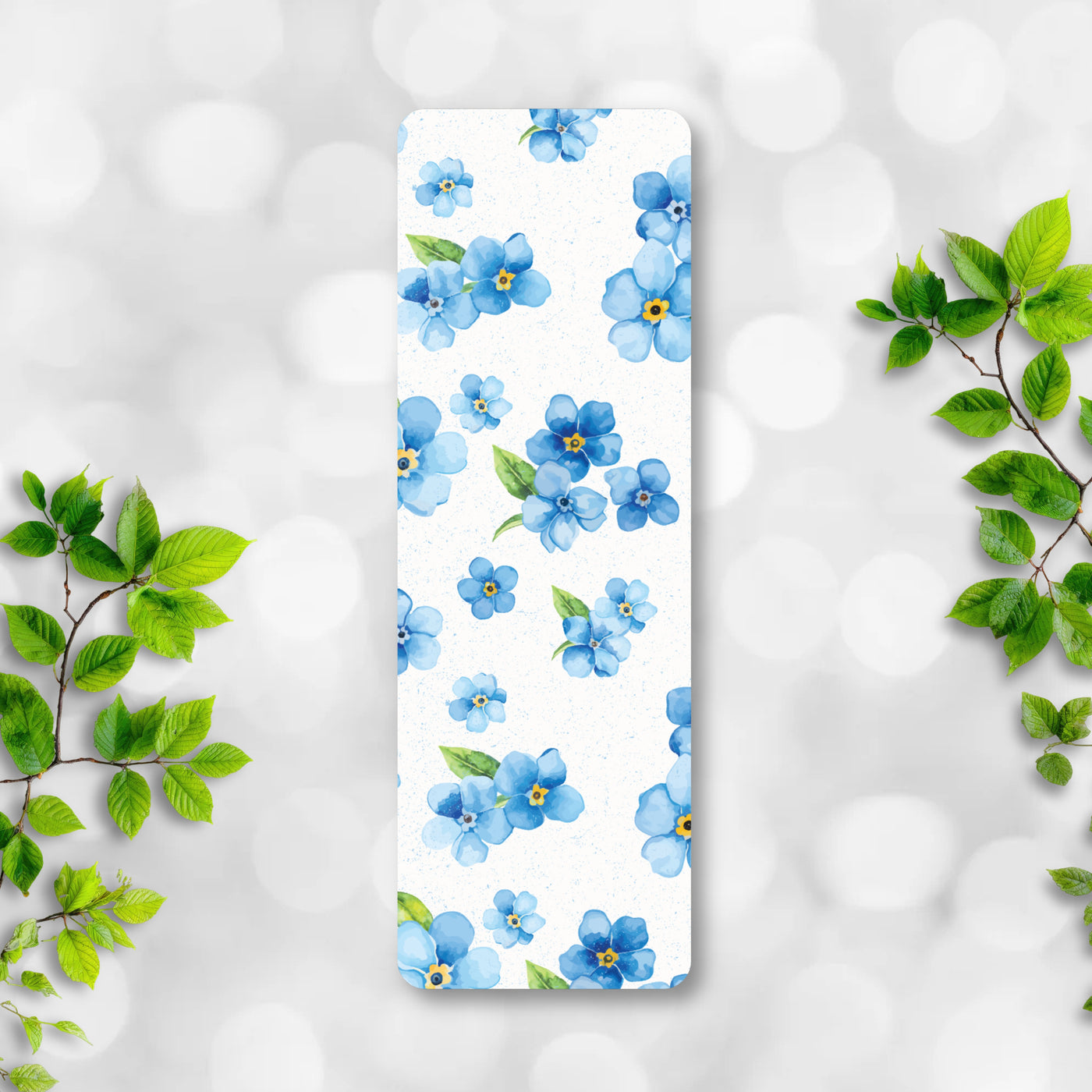 Bookmark with blue floral pattern on a white background.