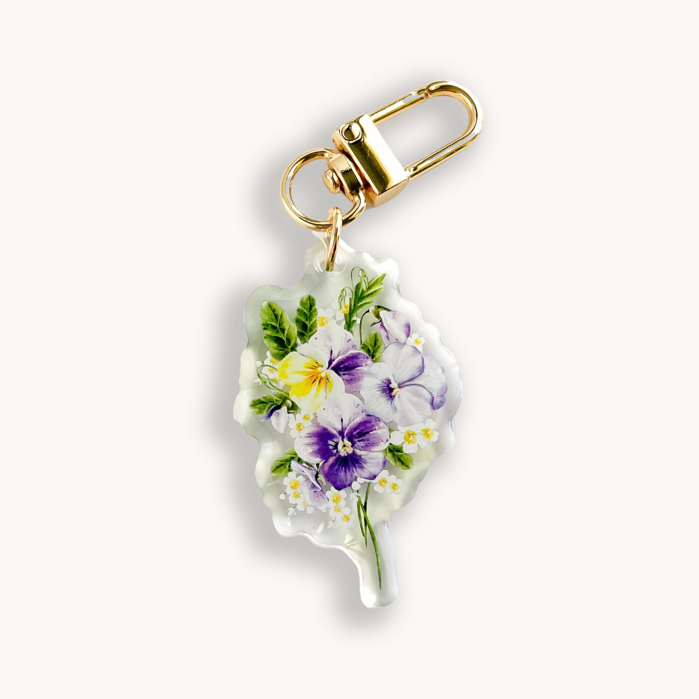 Keychain with floral design on a white background.