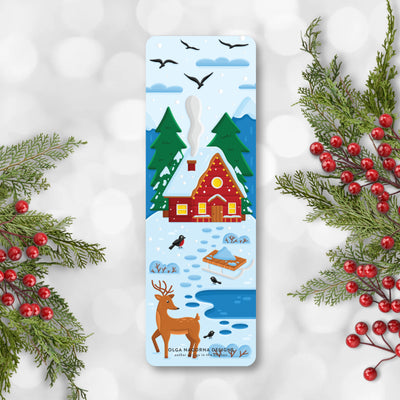 Winter-themed bookmark with a cabin, deer, and trees on a snowy background.