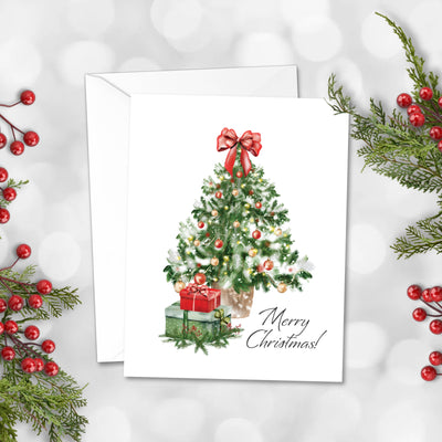 Christmas card with a decorated tree and presents on a white background with holly leaves and berries.