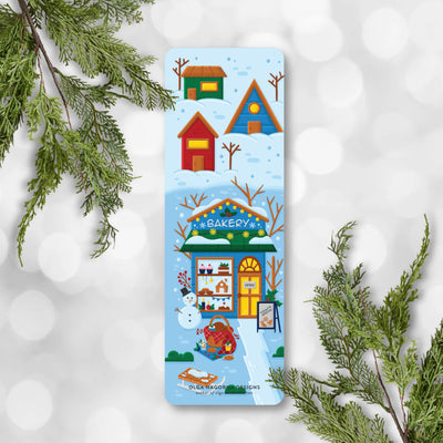 Colorful bookmark with winter scene design on a snowy background.