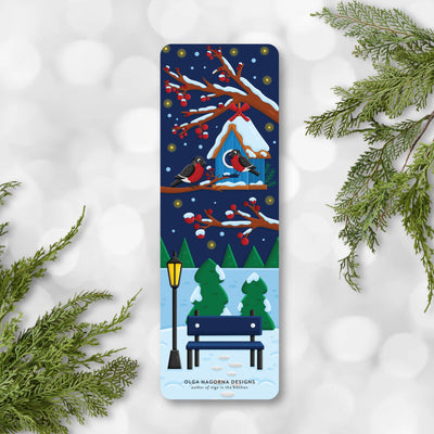 Winter-themed bookmark with snowy scene and birds, surrounded by greenery on a white background.