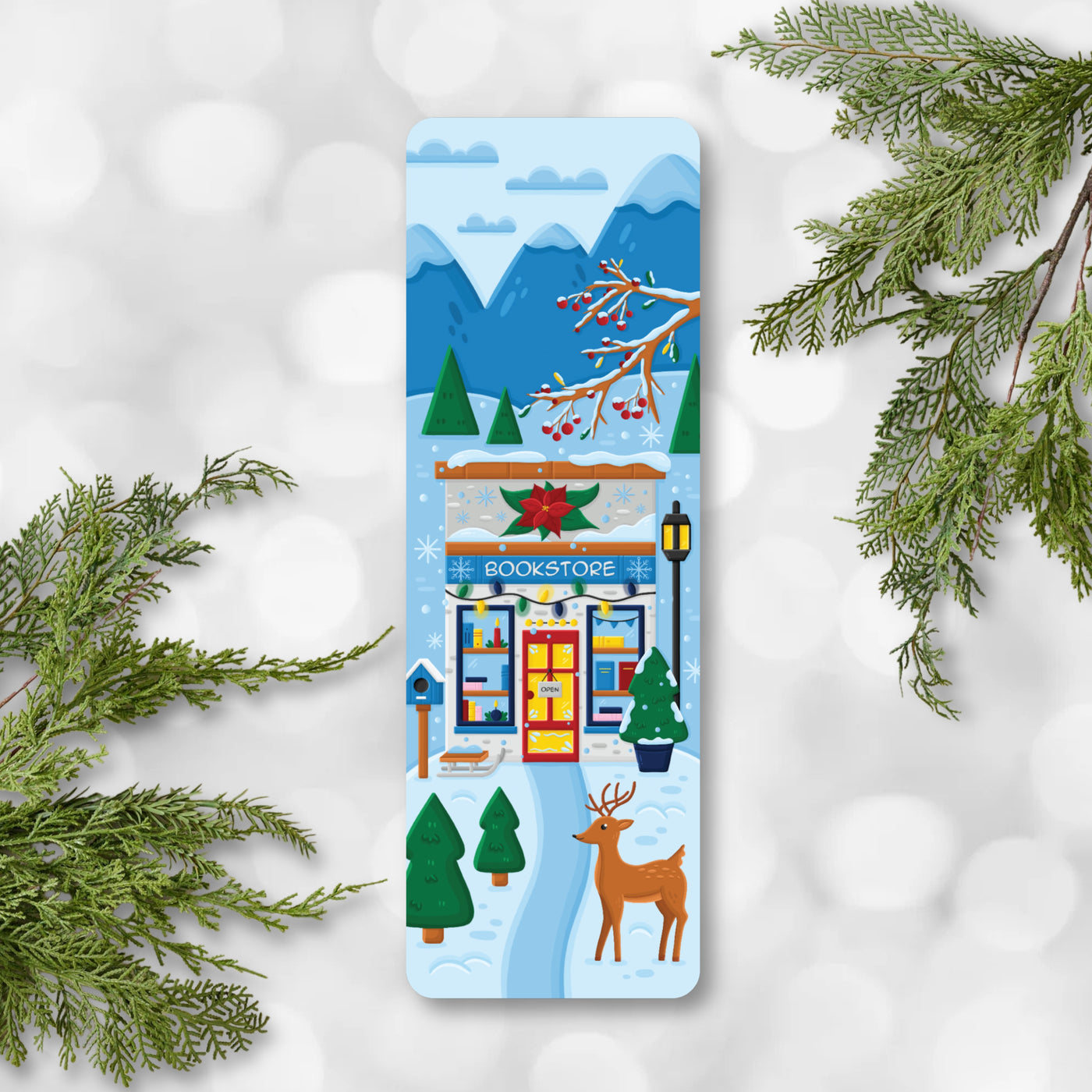 Winter-themed bookmark with a bookshop, deer, and snowy landscape on a white background with greenery.